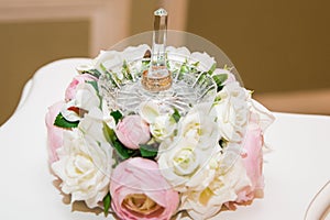 Wedding, Valentine`s day. Beautiful delicate wedding bouquet white and pink roses, wedding rings of the bride and groom