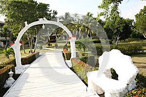 Wedding venue on the beach under palm trees with space for text