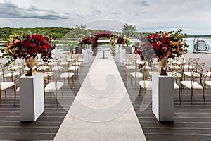 Wedding venue in the beautiful place near the lake. Wedding ceremony outdoors.