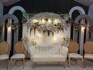 Wedding venue concept with colorful flowers and lights in the background