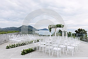 Wedding venue outdoor with the ocean and mountain background