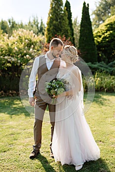 wedding walk of the bride and groom in a coniferous in elven accessories