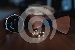 Wedding watches,wooden bow tie and the wedding rings