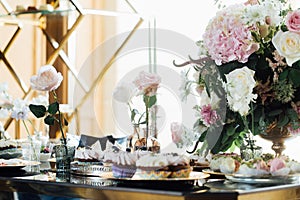 Wedding. Wedding details. Mr and Mrs. Delicious wedding reception candy bar table. Sweet holiday buffet with cupcakes photo