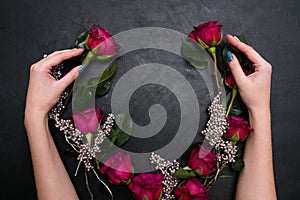 Wedding wreath composing red roses stylish bride