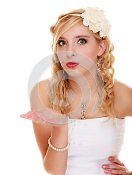 Wedding. Young woman romantic bride blowing a kiss