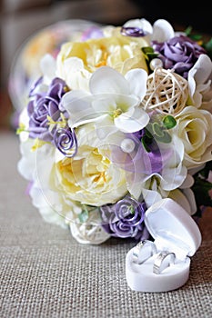 Weddings bouquet and golden rings