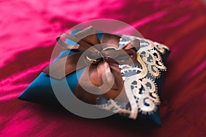 Weddings ring on the blue pillow
