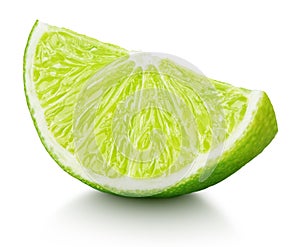 Wedge of green lime citrus fruit isolated on white