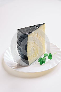 Wedge of semi-cured Manchego cheese