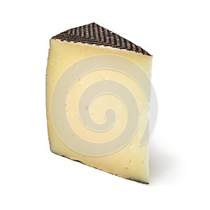 Wedge of Spanish Manchego cheese photo