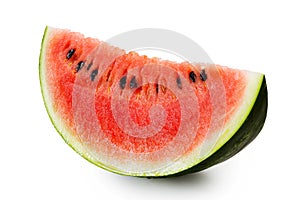 Wedge of watermelon with seeds isolated on white.