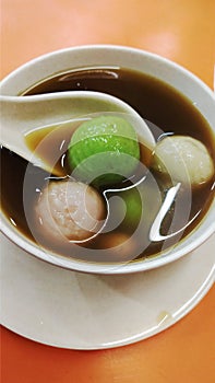 Wedhang ronde, made from brown sugar and ginger and added with onde filled with ground peanuts.