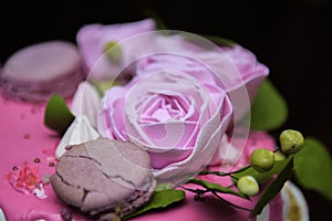 Weding cake with roses and cookies with water droplets on the petals photo
