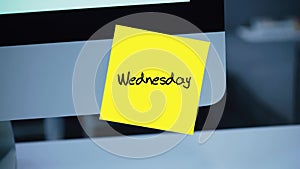 Wednesday. Days of the week. The inscription on the sticker on the monitor.