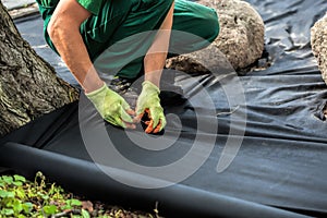 Weed barrier sheet installation