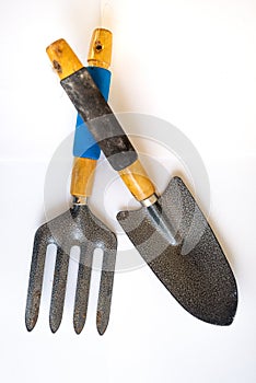 Weed fork and shovel, garden hand tool equipment, isolated on white background. Closeup, top view.
