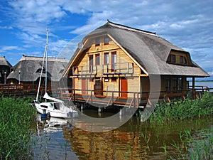 Weekend house on water with boat