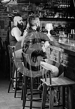 Weekend lifestyle. Guy bearded man sit at bar counter in pub. Pub great place to dine drink and have fun. Hipster