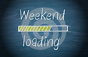 Weekend loading, blue chalkboard with text