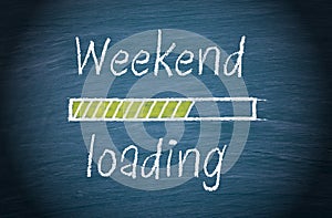 Weekend loading, blue chalkboard with text photo