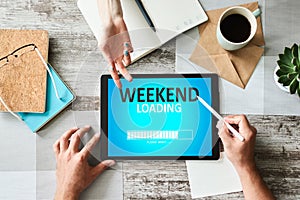 Weekend loading status bar message on device screen.