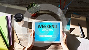 Weekend loading status bar message on device screen.