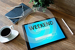 Weekend loading status bar message on device screen.