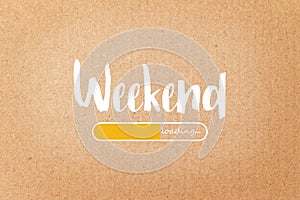 WEEKEND loading text on brown paper background