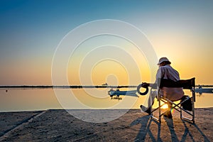 Weekend Old man fishing in Dammam Sea side Saudi Arabia