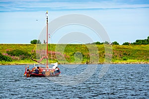 Weekend sailing on small jacht boat on riviers and canals in South Holland, Kaag, Netherlands