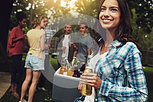 The weekend starts here. a young woman enjoying a party with friends outdoors.