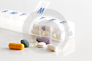 A weekly container of tablets, vitamins etc