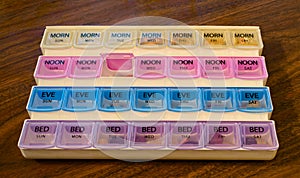 Weekly pill organizer and container photo
