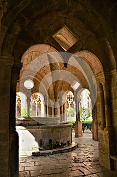Weel of the monastery of Santes Creus with the cloister in the background