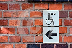 Weelchair Sign on a brick facade