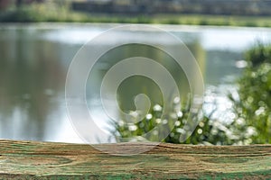 Weeping willow trees reflected on a river, reflection in the water in autumn