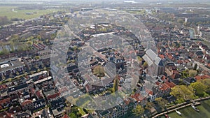 Weesp small city in North holland, The Netherlands, city view along the water aerial drone footage.