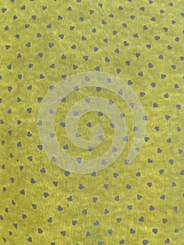 Weft of a green fabric with dots