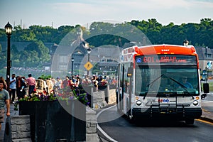 WeGo Transit NovaBus LFX Articulated Bus passes some tourists in Niagara Falls