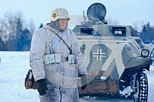 Wehrmacht officier in winter camouflage with the Sd.Kfz. 251 Sonderkraftfahrzeug 251.