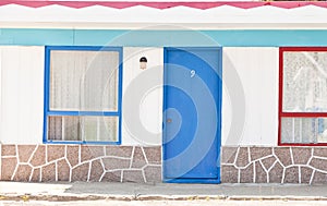 Motel with red and blue doors
