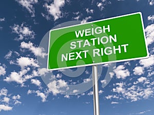 weigh station next right traffic sign on blue sky photo