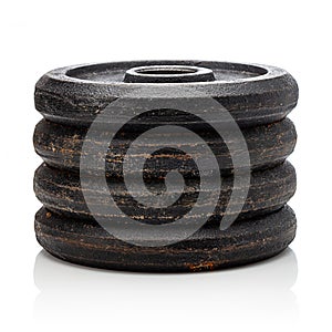 Weight discs in stack on white background