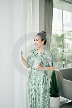 Weight loss concept. beautiful young woman drinking milk at home