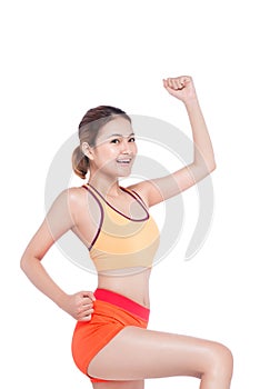 Weight loss concept. Cheerful young exercising woman, isolated o