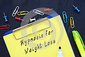 Weight Loss concept about Weight Loss Hypnosis with phrase on the page photo