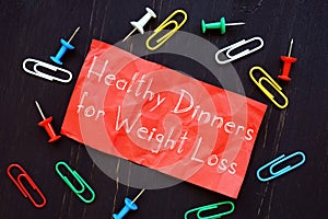 Weight Loss concept meaning Weight Loss Dinners with phrase on the piece of paper
