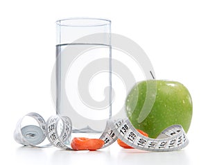 Weight loss concept with tape measure organic green apple