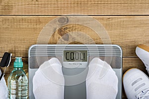 Weight loss concept with top view of weighting on scales